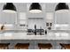 Stylish kitchen with large island, marble countertops, stainless steel appliances, and modern lighting at 1054 Euclid Ne Ave, Atlanta, GA 30307