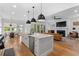 Open concept kitchen features a marble island, stainless appliances, and seamless flow to the living room at 1054 Euclid Ne Ave, Atlanta, GA 30307
