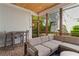 Charming outdoor patio features comfortable seating, stylish bar seating, and views of the backyard's lush greenery at 1054 Euclid Ne Ave, Atlanta, GA 30307
