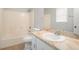 Clean bathroom featuring a shower-tub combination, neutral walls, and a vanity with a marble countertop at 1512 Daniel Ln, Lawrenceville, GA 30046