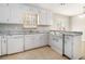 Functional kitchen with white cabinets, granite countertops, and modern appliances at 1512 Daniel Ln, Lawrenceville, GA 30046