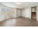 Spacious living room featuring natural light, wood-look floors, and convenient access to the staircase at 1512 Daniel Ln, Lawrenceville, GA 30046