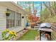 Back patio with grill and outdoor furniture creating an inviting outdoor space at 3075 Camden Way, Alpharetta, GA 30005
