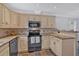 Well-lit kitchen featuring granite countertops and stainless steel appliances at 3075 Camden Way, Alpharetta, GA 30005