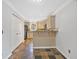 Cozy dining area leading into kitchen with tile flooring and cream cabinetry at 3075 Camden Way, Alpharetta, GA 30005