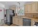 Kitchen area featuring stainless steel appliances and a granite countertop at 3075 Camden Way, Alpharetta, GA 30005