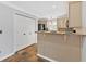 Kitchen with tiled floors and granite counter open to a breakfast bar at 3075 Camden Way, Alpharetta, GA 30005