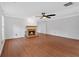 Bright living room with hardwood flooring, fireplace, and large windows at 3075 Camden Way, Alpharetta, GA 30005