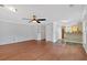 Large living room with hardwood floors and view of kitchen area at 3075 Camden Way, Alpharetta, GA 30005