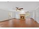 Spacious living room with hardwood floors, a fireplace, and natural light at 3075 Camden Way, Alpharetta, GA 30005