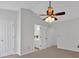Bright main bedroom boasts vaulted ceiling with ceiling fan and ensuite bathroom at 3075 Camden Way, Alpharetta, GA 30005