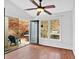 Bright sunroom with hardwood floors and sliding doors to the backyard at 3075 Camden Way, Alpharetta, GA 30005