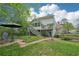 A lovely backyard featuring a patio with outdoor seating and a walkway leading to the house at 4783 Deer Chase, Powder Springs, GA 30127