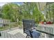 Spacious backyard features a large deck, lush lawn, mature trees, and fencing at 4783 Deer Chase, Powder Springs, GA 30127