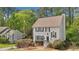 Charming home featuring a classic design, well-maintained landscaping, and a cozy, inviting facade with mature trees at 4783 Deer Chase, Powder Springs, GA 30127