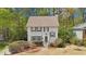 Charming two-story home with a well-manicured front yard and inviting entrance surrounded by mature trees at 4783 Deer Chase, Powder Springs, GA 30127