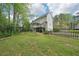 Charming home with manicured lawn, mature trees, and a spacious backyard with deck at 4783 Deer Chase, Powder Springs, GA 30127