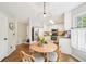 Cozy eat-in kitchen area featuring stainless steel appliances, granite counters, and a charming round wooden table at 4783 Deer Chase, Powder Springs, GA 30127