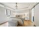 Comfortable main bedroom with hardwood floors, tray ceilings, and modern lighting at 4783 Deer Chase, Powder Springs, GA 30127