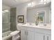 A stylish bathroom with a double sink vanity, large mirror, and glass-enclosed shower at 5607 Hislop Ln # 80, Mableton, GA 30126