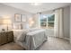 Comfortable bedroom featuring a queen bed, side tables, and window for a serene and relaxing atmosphere at 5607 Hislop Ln # 80, Mableton, GA 30126