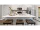 Modern kitchen featuring stainless steel appliances, white cabinets, a spacious island with bar seating at 5607 Hislop Ln # 80, Mableton, GA 30126