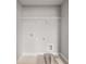 Bright laundry room featuring upper shelf and modern utility hookups ready for appliance installation at 5607 Hislop Ln # 80, Mableton, GA 30126