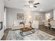 Inviting living room leading into dining area, featuring elegant decor and modern lighting at 5607 Hislop Ln # 80, Mableton, GA 30126