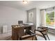 Bright and spacious office with a large wooden desk, comfortable seating, and bright, natural light at 5607 Hislop Ln # 80, Mableton, GA 30126