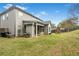 Beautiful backyard featuring a covered patio and play structure perfect for outdoor entertaining at 3478 Crayton Glen Way, Buford, GA 30519