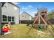 Lovely backyard featuring a playset and ample space for fun and Gathering activities at 3478 Crayton Glen Way, Buford, GA 30519