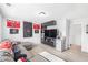 A spacious basement boasts entertainment options, ample storage, and sporty decor at 3478 Crayton Glen Way, Buford, GA 30519
