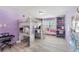 Spacious lavender bedroom featuring a lofted bed, desk, shelving, and a cozy window seat at 3478 Crayton Glen Way, Buford, GA 30519