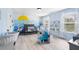 Bedroom with blue walls, white trim, light floors, and playful nautical wall art at 3478 Crayton Glen Way, Buford, GA 30519