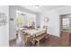 The dining room boasts hardwood floors and is open to the sunroom at 3478 Crayton Glen Way, Buford, GA 30519