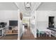 Bright hallway featuring hardwood floors, white wainscoting, and views to the living room at 3478 Crayton Glen Way, Buford, GA 30519