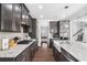 Stylish kitchen with stainless steel appliances, granite countertops, and a farmhouse sink at 3478 Crayton Glen Way, Buford, GA 30519
