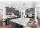 Modern kitchen with stainless steel appliances, granite countertops, and a center island at 3478 Crayton Glen Way, Buford, GA 30519