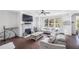 Cozy living room with a fireplace, large windows, and a comfortable sectional sofa at 3478 Crayton Glen Way, Buford, GA 30519