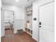 A mudroom with built-in storage, bench seating, and stylish decor for added convenience at 3478 Crayton Glen Way, Buford, GA 30519