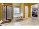 Bathroom featuring a shower, soaking tub, tile flooring, and decorative elements throughout at 415 Damascus Ct, Fairburn, GA 30213