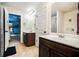 Bathroom featuring double sinks, a full shower, and colorful decor nearby at 415 Damascus Ct, Fairburn, GA 30213