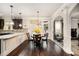 Eat-in kitchen area with hardwood floors, granite countertops, and access to the backyard at 415 Damascus Ct, Fairburn, GA 30213