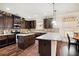 Spacious kitchen boasts dark wood cabinets, granite countertops, and a center island at 415 Damascus Ct, Fairburn, GA 30213