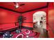 Unique living room features bold red walls, dark trim, and stylish decor elements at 415 Damascus Ct, Fairburn, GA 30213