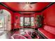 Eclectic living space with red walls, a seating area, and views to the outdoor space at 415 Damascus Ct, Fairburn, GA 30213