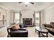 Comfortable Gathering room featuring a stone fireplace, neutral paint, and ample natural light at 415 Damascus Ct, Fairburn, GA 30213