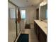 Bathroom features a walk-in shower, separate tub, dual sinks and tile flooring at 61 N Auburn Landing Pl, Auburn, GA 30011
