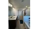 Spacious bathroom with dual sinks, walk-in shower and tile floors at 61 N Auburn Landing Pl, Auburn, GA 30011