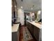 Bright kitchen features stainless steel appliances, white countertops, and wood cabinets at 61 N Auburn Landing Pl, Auburn, GA 30011